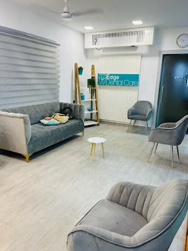 Edge Dental Care warm and modern waiting lounge with grey velvet seating